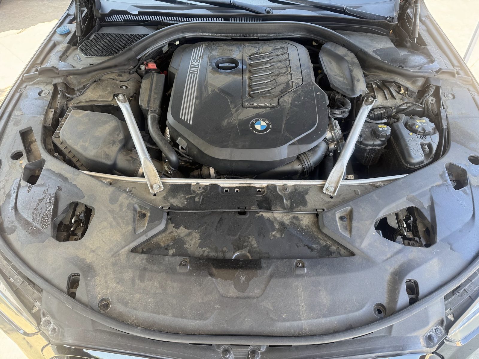 Dusty engine bay before detailing