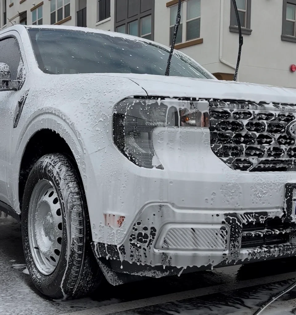 Truck getting a foam cannon hand wash